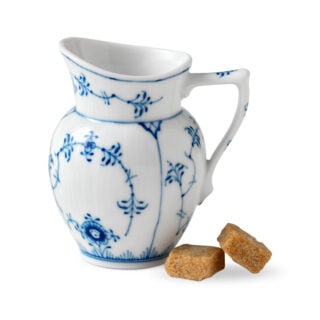 Royal Copenhagen Blue Fluted Plain Cream Jug shown on table | Kneen & Co