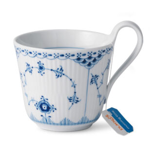 Royal Copenhagen Blue Fluted Half Lace High Handle Cup shown on table | Kneen & Co