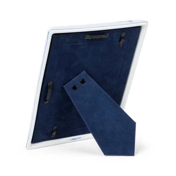 RoyalCopenhagen-1072399-Blue-FlutedPlain-PhotoFrame-16pt5x21-cm-10x15-cm-3-1200x1200-100KB Royal Copenhagen Blue Fluted Plain Picture Frame shown on table | Kneen & Co