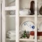 Royal Copenhagen Blue Fluted Mega Dinnerware in cabinet | Kneen & Co