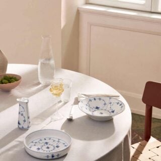 Royal Copenhagen Blue Fluted Plain Dinnerware set on table | Kneen & Co