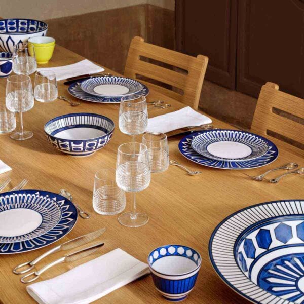 Hermes Bleus D'Ailleurs Dinnerware set on table | Kneen & Co