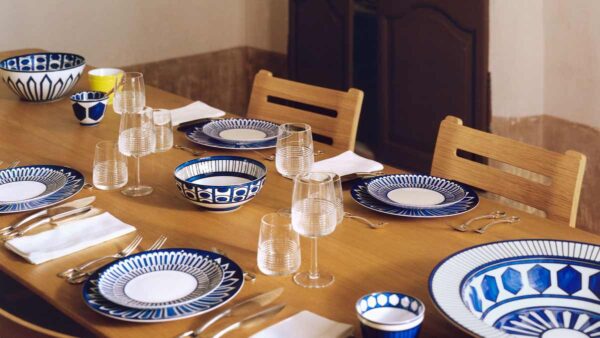 Hermes Bleus D'Ailleurs Dinnerware set on table | Kneen & Co