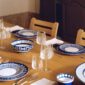 Hermes Bleus D'Ailleurs Dinnerware set on table | Kneen & Co