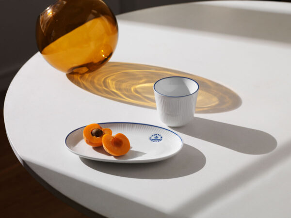 RC-Blueline-Oval-dish-23,5cm-Thermal-Mug-1200w-100KB Royal Copenhagen Blueline Dinnerware set on table | Kneen & Co