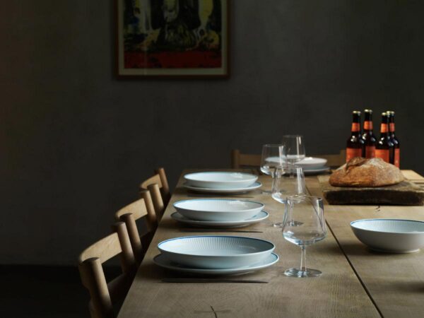 RC-Blueline-Plate-27cm-Blueline-bowl-25cm-1200w-100KB Royal Copenhagen Blueline Dinnerware set on table | Kneen & Co