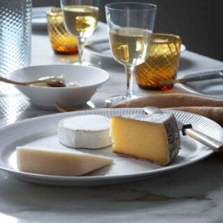 RC-Table-Setting-WhiteFluted-03-1200w-100KB Royal Copenhagen White Fluted Dinnerware set on table | Kneen & Co