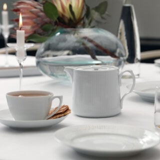 RC-Tablesetting-WhiteFluted-Page55-1200w-100KB Royal Copenhagen White Fluted Tea Service set on table | Kneen & Co