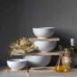 White Fluted Dinnerware set bowls on table | Kneen & Co