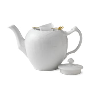 RoyalCopenhagen-1017279-WHITE-FLUTED-HL-TEAPOT-100CL-01-1200×1200-100KB Royal Copenhagen White Fluted Half Lace Teapot shown on table | Kneen & Co