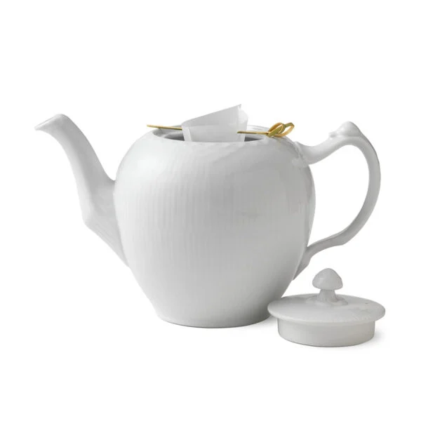 Royal Copenhagen White Fluted Half Lace Teapot shown on table | Kneen & Co