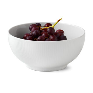Royal Copenhagen White Fluted Serving Bowl shown on table | Kneen & Co