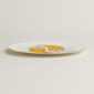 Hermès Kaorumi Dessert Plate – Banana shown on table | Kneen & Co