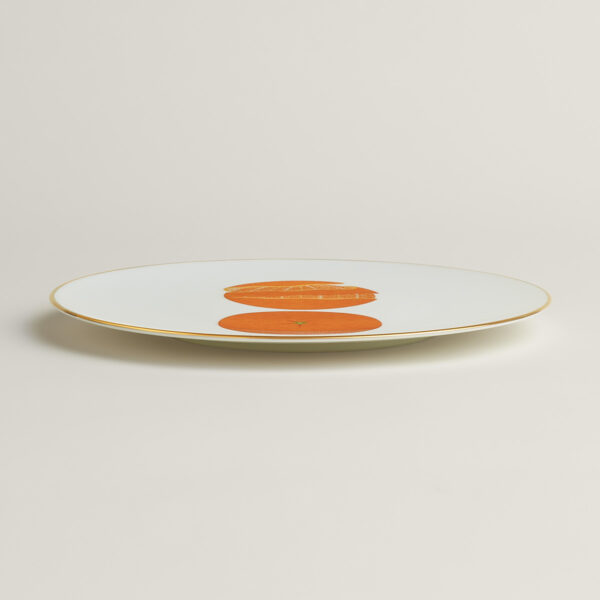 Hermès Kaorumi Dessert Plate – Orange shown on table | Kneen & Co