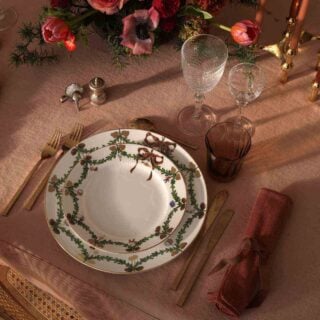 Royal Copenhagen Star Fluted Christmas DInnerware set on table | Kneen & Co