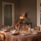 Royal Copenhagen Star Fluted Christmas DInnerware set on table | Kneen & Co