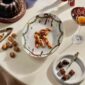 Royal Copenhagen Star Fluted Christmas DInnerware set on table | Kneen & Co