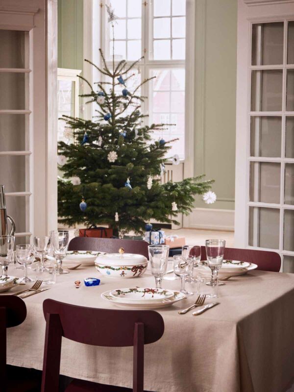 Royal Copenhagen Star Fluted Christmas DInnerware set on table | Kneen & Co
