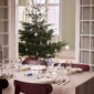 Royal Copenhagen Star Fluted Christmas DInnerware set on table | Kneen & Co