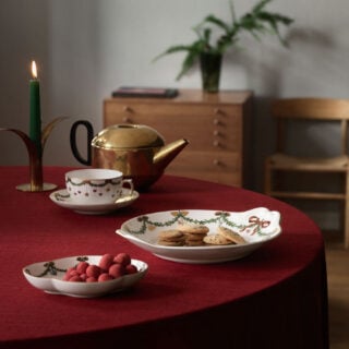 Royal Copenhagen Star Fluted Christmas DInnerware set on table | Kneen & Co