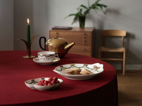 Royal Copenhagen Star Fluted Christmas DInnerware set on table | Kneen & Co
