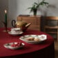 Royal Copenhagen Star Fluted Christmas DInnerware set on table | Kneen & Co