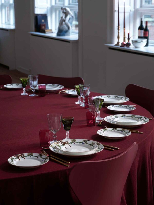 Royal Copenhagen Star Fluted Christmas DInnerware set on table | Kneen & Co