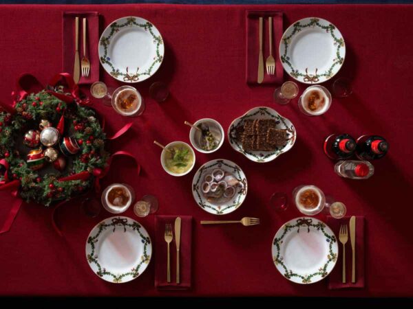 Royal Copenhagen Star Fluted Christmas DInnerware set on table | Kneen & Co