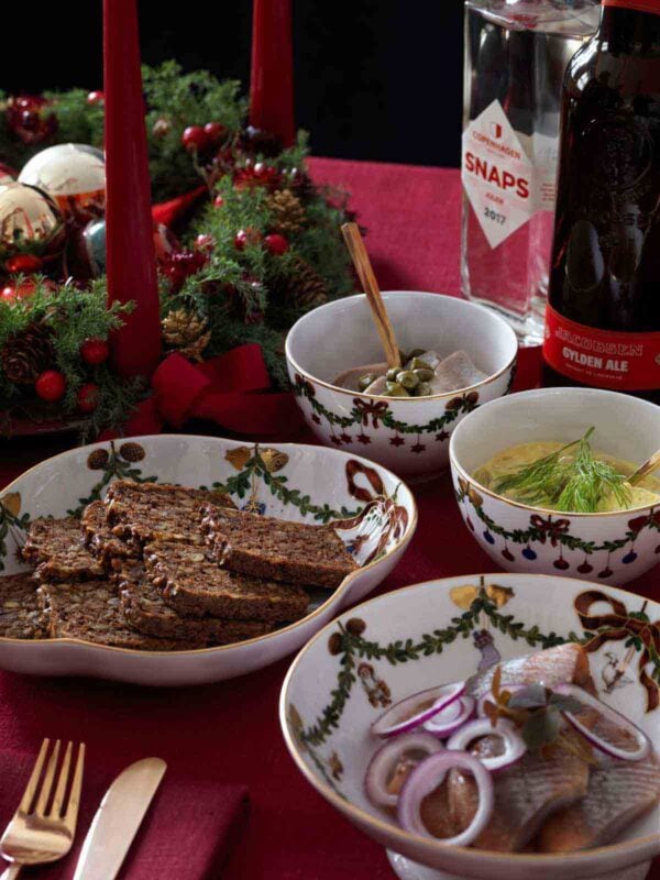 Royal Copenhagen Star Fluted Christmas DInnerware set on table | Kneen & Co