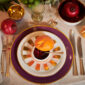 Augarten assorted dinnerware set on table | Kneen & Co