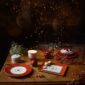 Bernardaud Noël Dinnerware Dessert Plates set on Holiday Table | Kneen & Co
