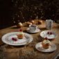 Bernardaud Noël Dinnerware Dessert Plates set on Holiday Table | Kneen & Co