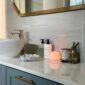Bernardaud Votive Lights set on bathroom counter | Kneen & Co