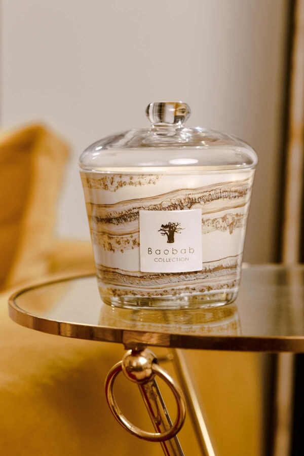 BAOBAB-Cloch-Lifestyle-1200w-100KB Golden interior setting with Baobab Collection candle in marbled glass with clear dome lid | Kneen & Co