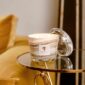 Golden interior setting with Baobab Collection candle in marbled glass with matching clear dome | Kneen & Co