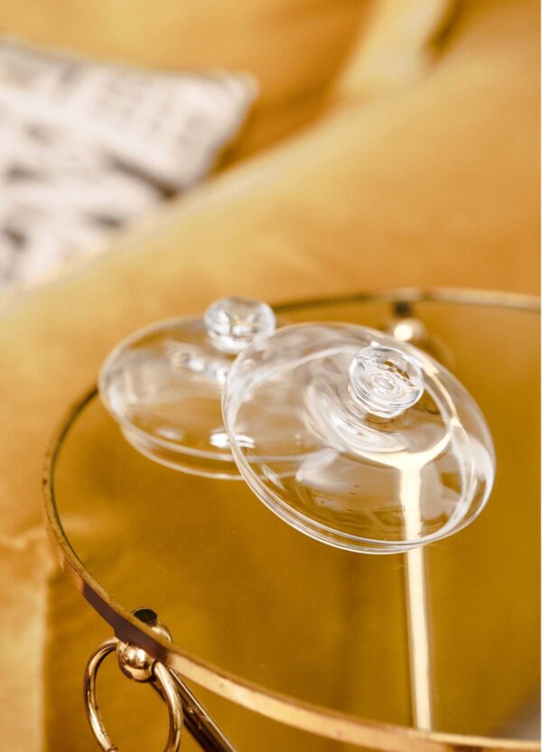 BAOBAB-Domes-Mood-1200w-100KB Golden interior setting with Baobab Collection candle domes in clear glass and hand-blown finish | Kneen & Co