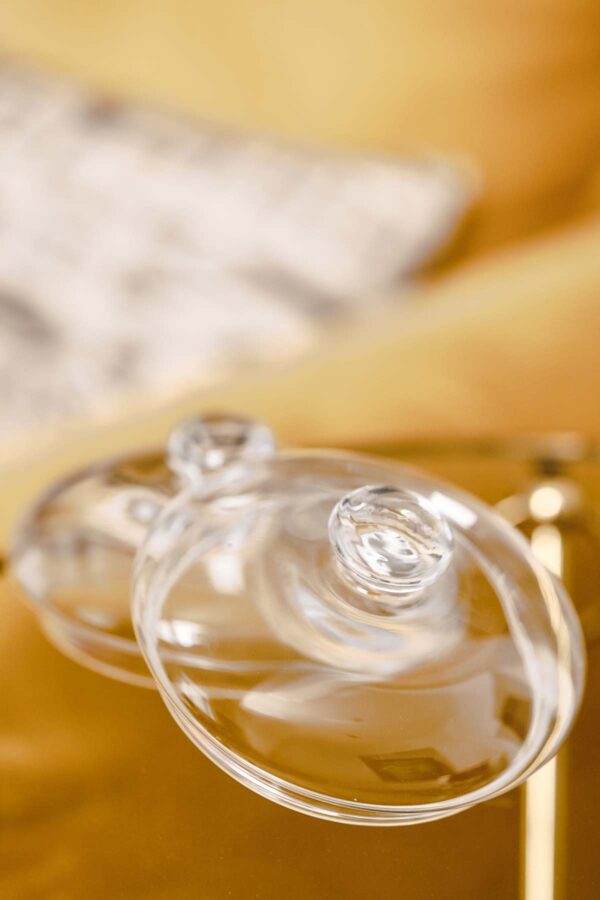 Warm interior closeup with Baobab Collection candle domes in clear hand-blown glass | Kneen & Co
