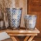 Warm domestic setting with two Baobab Gentlemen Candles in blue and silver-rimmed glass | Kneen & Co