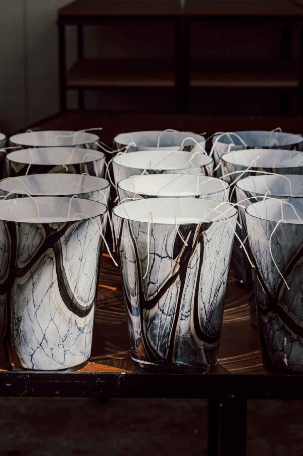 Workshop environment with Baobab Collection Stones Marble candles in hand-blown glass grey marble with black strokes edged in beige | Kneen & Co