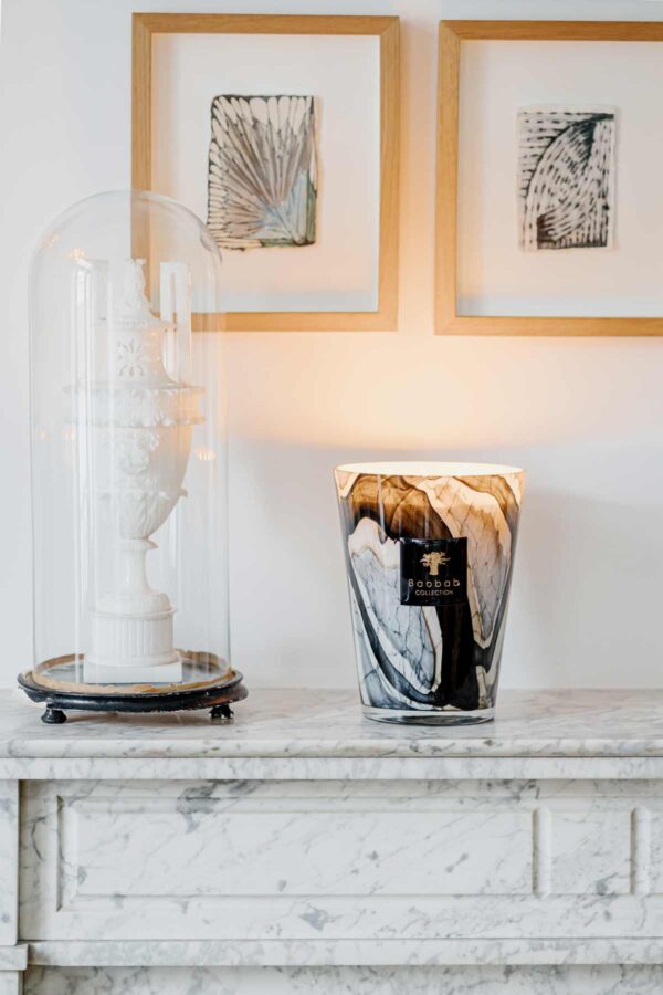 Elegant mantel display with Baobab Collection Stones Marble candle in hand-blown glass grey marble with black strokes edged in beige | Kneen & Co