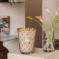 Modern interior setting with lit Baobab Women Candle Max 35 in delicately printed glass with 24-carat yellow gold | Kneen & Co