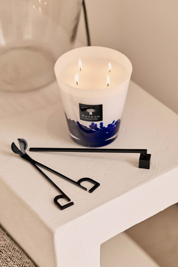 Minimalist indoor setting with Baobab Collection candle accessories and Baobab candle in blue and white glass | Kneen & Co