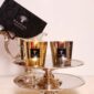 Elegant dining setting with Baobab Aurum and Platinum Les Exclusives Candle Duo in metallic gold and silver glass | Kneen & Co