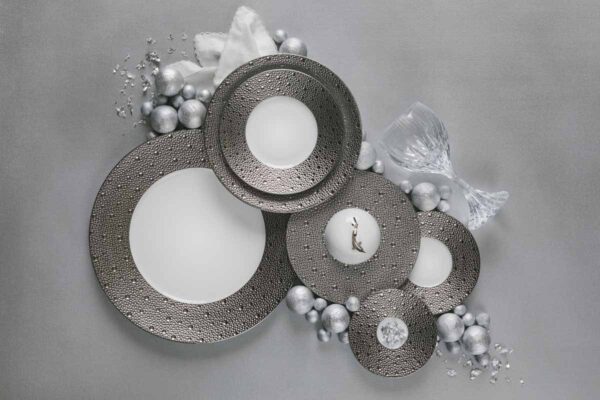 Festive flat lay of Bernardaud Écume Platinum Dinnerware in a textured platinum and white finish | Kneen & Co