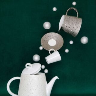 Whimsical display of Bernardaud Écume Platinum tea set in a textured platinum and white finish | Kneen & Co