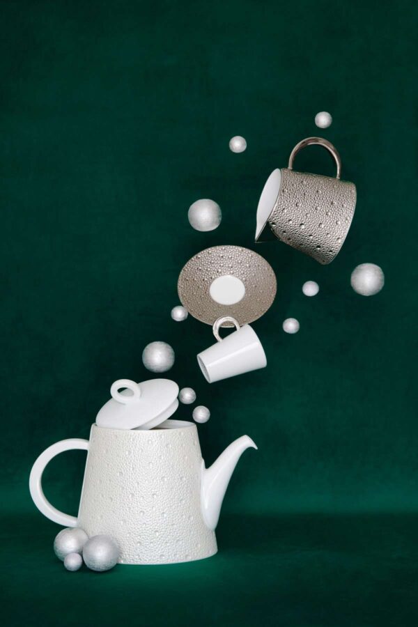 Whimsical display of Bernardaud Écume Platinum tea set in a textured platinum and white finish | Kneen & Co