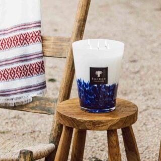 Baobab Feathers Touareg Scented Candle Max 16 | Kneen & Co Lifestyle photo on beach.