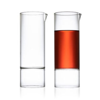 Minimalist white studio background with a pair of Fferrone Revolution Carafes in borosilicate glass | Kneen & Co
