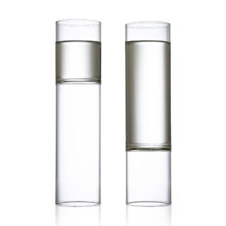 Minimalist white studio background with a pair of Fferrone Revolution Champagne Flutes in borosilicate glass | Kneen & Co