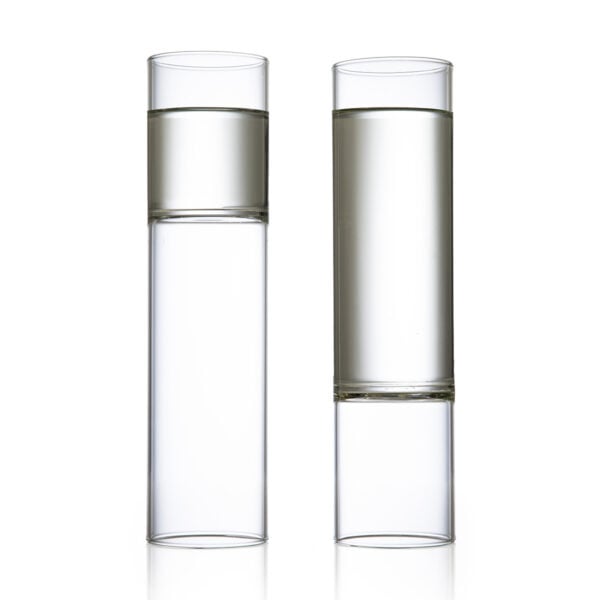 Minimalist white studio background with a pair of Fferrone Revolution Champagne Flutes in borosilicate glass | Kneen & Co